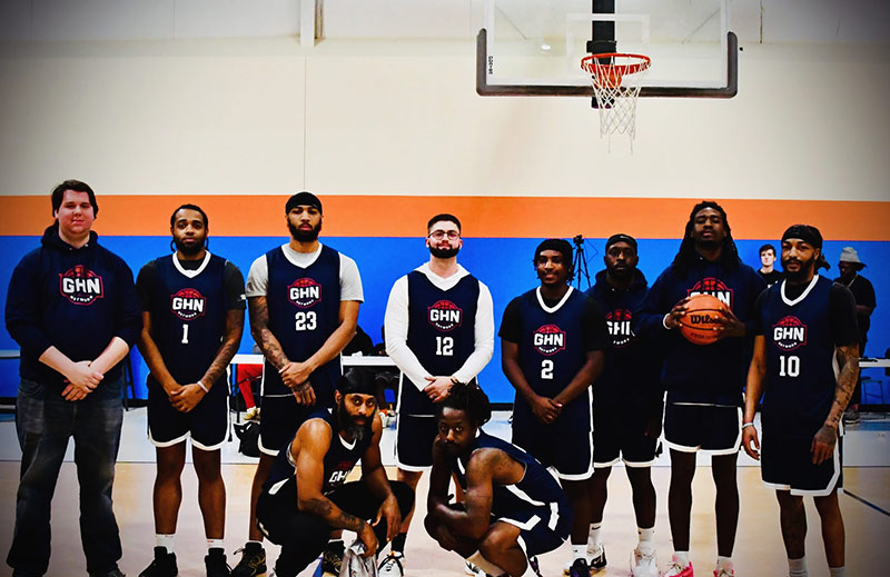 Mark Page (center) with his Gospel Hoops Network team at a tournament in partnership with the Raleigh Firebirds men’s professional basketball team and Ballers Unite.